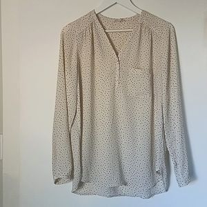 White blouse with black polka dots.